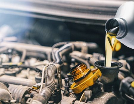 Pouring,Oil,To,Car,Engine.,Fresh,Motor,Oil,Poured,During Pouring,Oil,To,Car,Engine.,Fresh,Motor,Oil,Poured,During